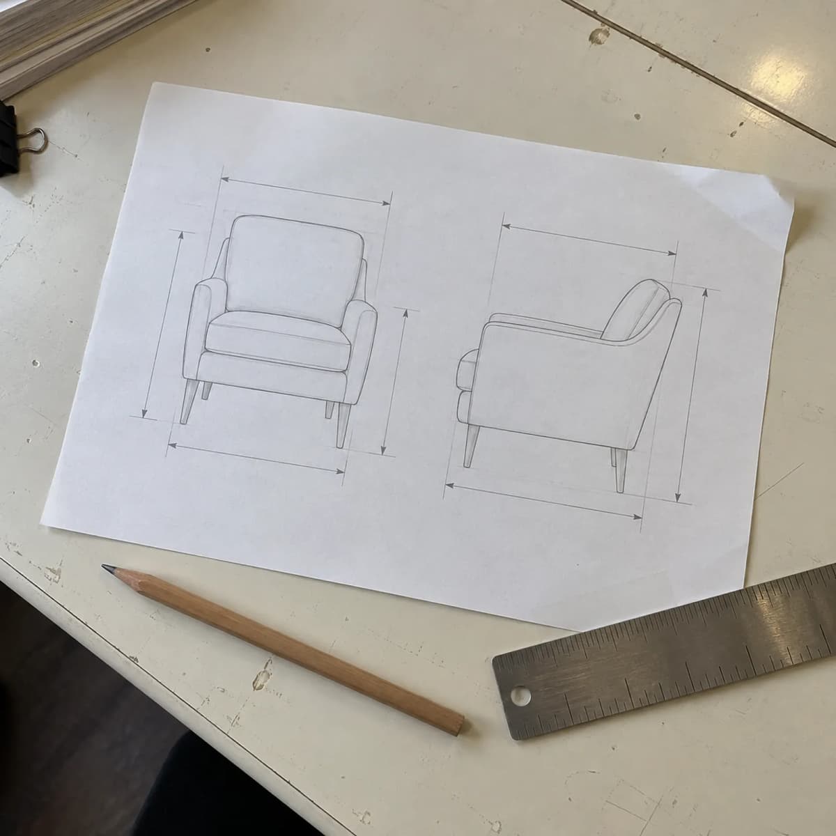 Furniture dimension line drawing with pencil and ruler on a desk