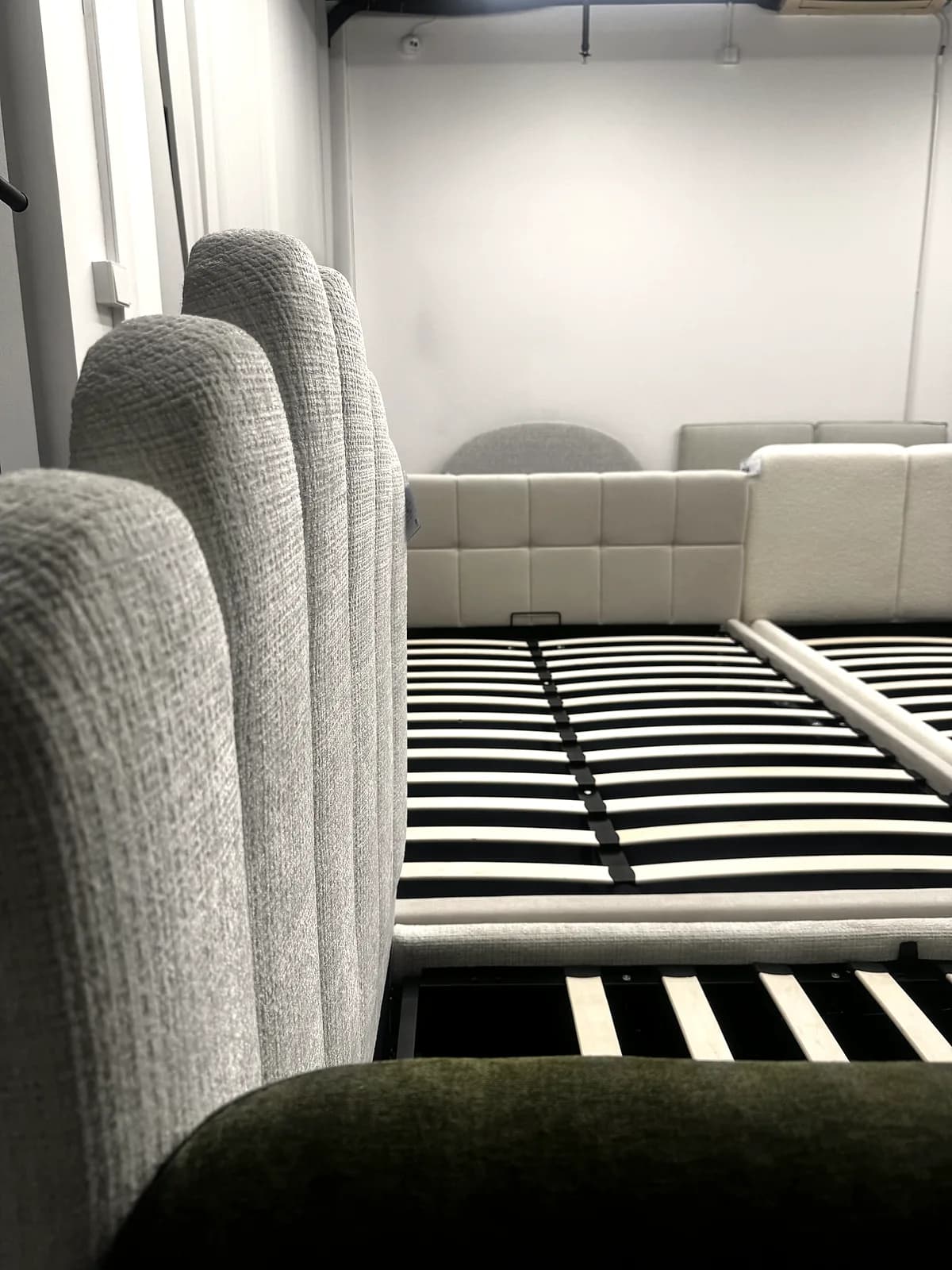 Vertical-channel upholstered headboard detail at the CasaViva studio