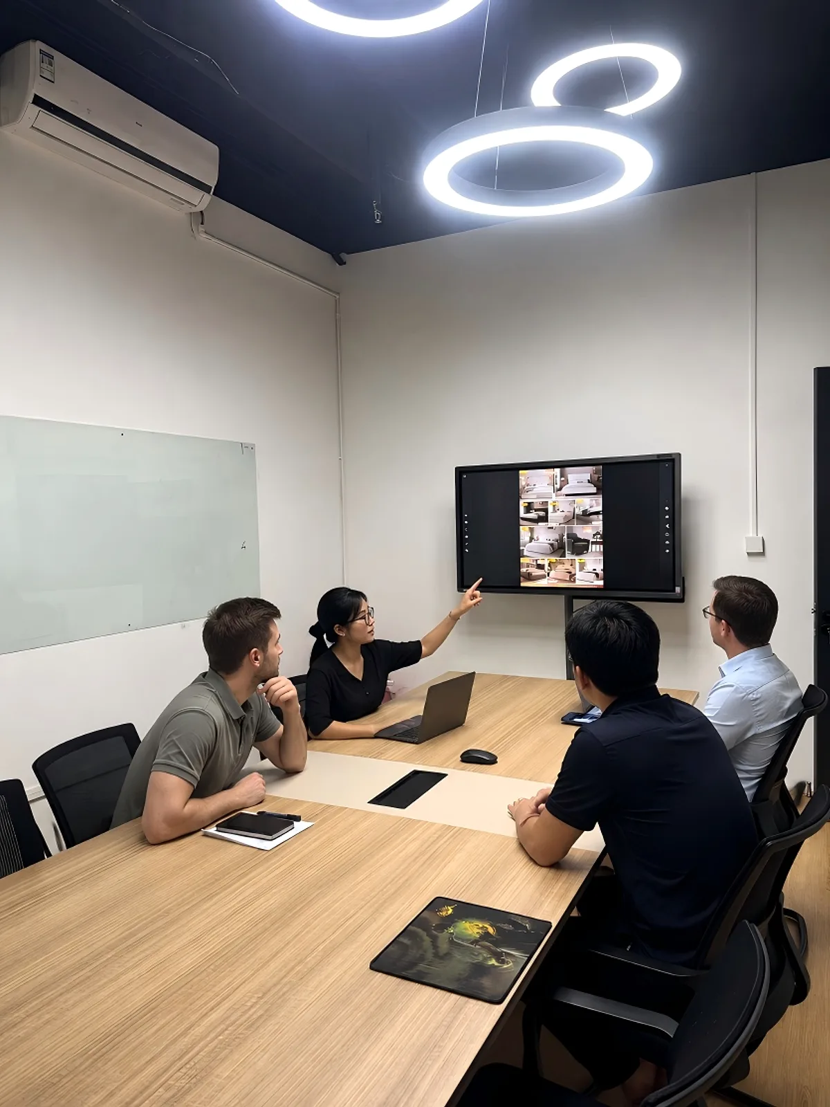 Meeting room at the CasaViva Selection Studio, with upholstered bed designs on screen